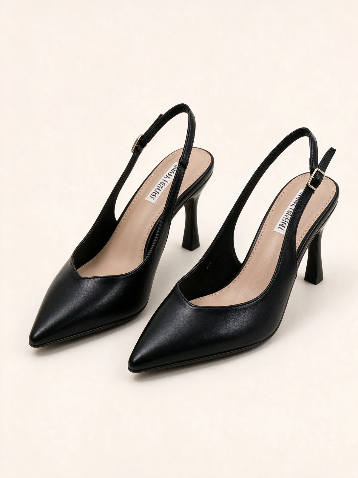 Scarpe décolleté slingback nere eleganti a punta con tacco alto e cinturino regolabile, disposte su sfondo neutro - SUNTIMEMODA